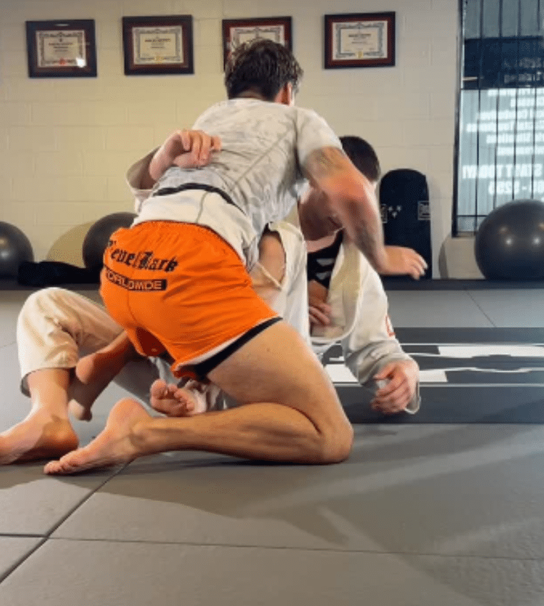 Hosford BJJ wrestling students grappling on mats.